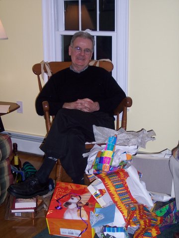 Tom Jackson in front of presents