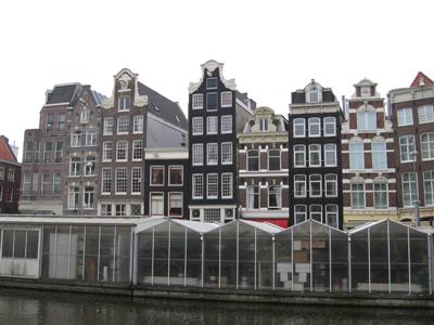 These homes have waterfront shops in front on the other side of the street