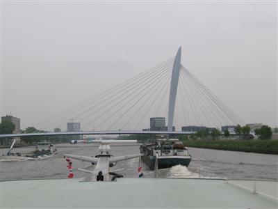 Approaching a typical European suspension bridge, along with several commercial boats (this bridge probably in Utrecht)