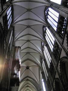 An organ is mounted high on the wall