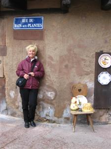 Kathy waiting outside a shop for our friends