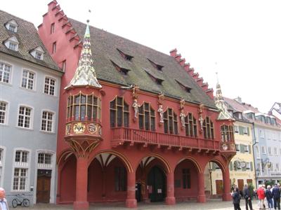 An elaborately decorated building across from the cathedral