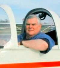 Jim Brennan in a plane